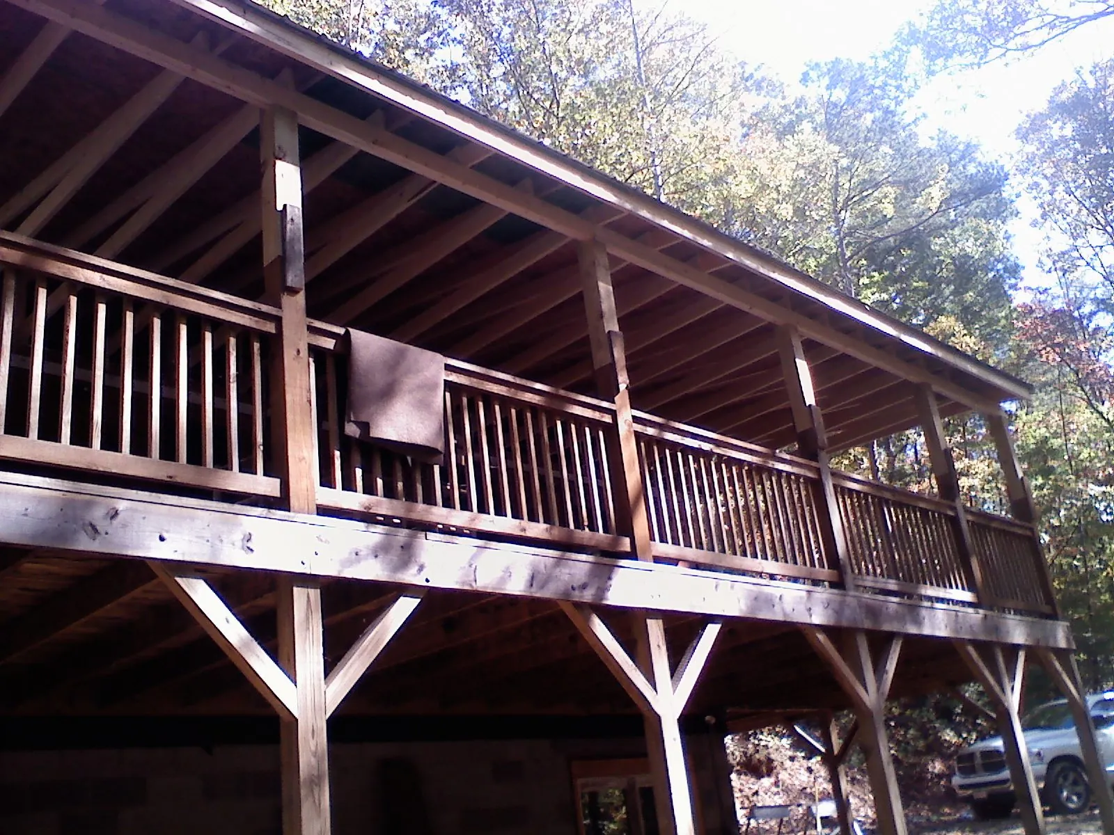 Timber framing under a new elevated porch and deck — Roof Leak Repair in Salina by Roofing Brothers